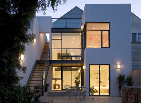 Exterior view at dusk of modern addition.