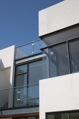 Exterior close-up of corner window and catwalk.