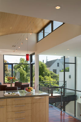 view from kitchen into atrium overlooking the garden.  The vaulted bamboo ceiling and clerestory windows allows for natural ventillation and passive cooling.
