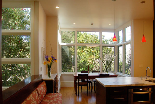 New dining bay surrounded by greenery from the rear garden.