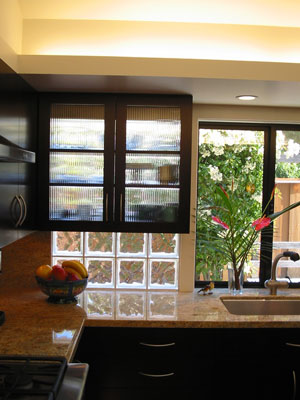 Detail of glass block behind glass-panel upper cabinets.